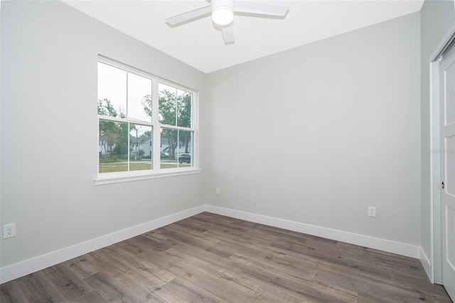 spare room featuring ceiling fan and hardwood / wood-style flooring