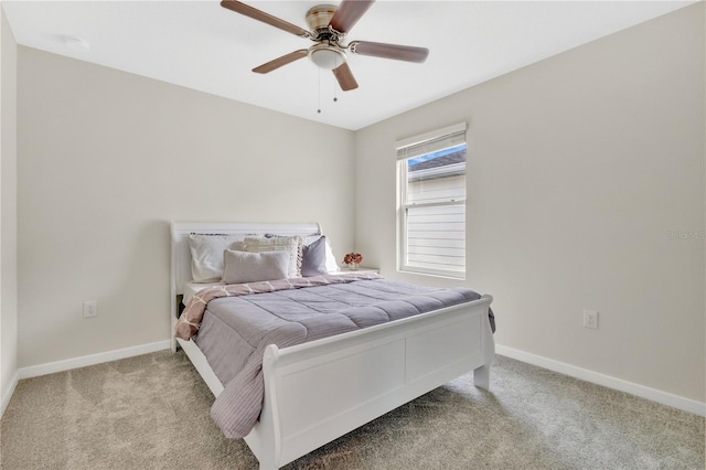 bedroom with ceiling fan and light carpet