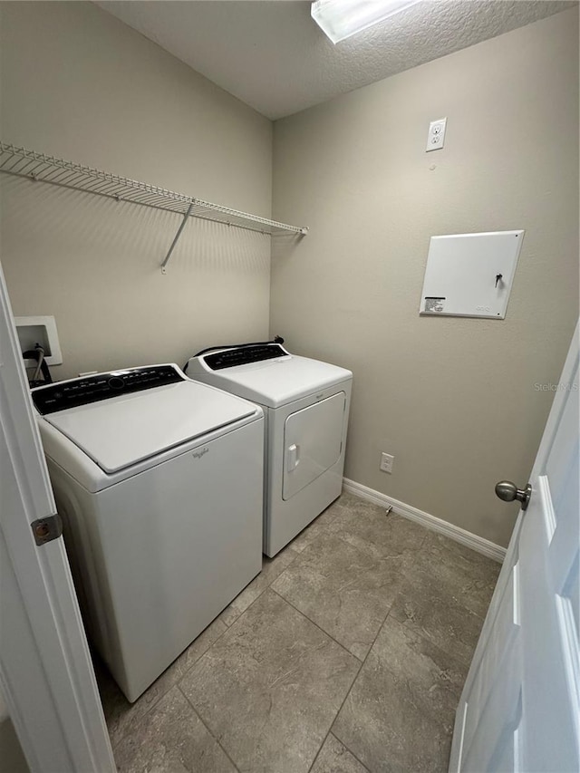 laundry room with washer and clothes dryer