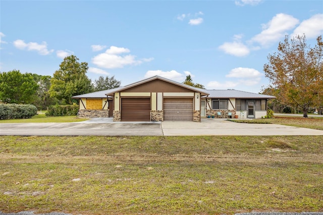 ranch-style home with a front lawn and a garage