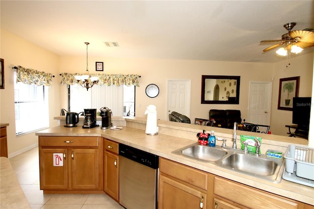 kitchen featuring sink, dishwasher, light tile patterned floors, ceiling fan with notable chandelier, and hanging light fixtures