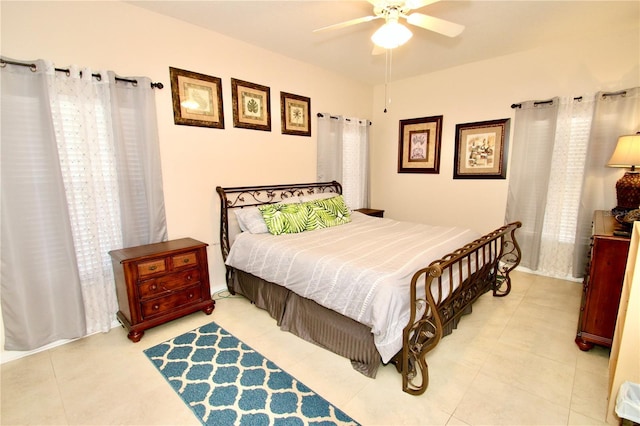 tiled bedroom with ceiling fan