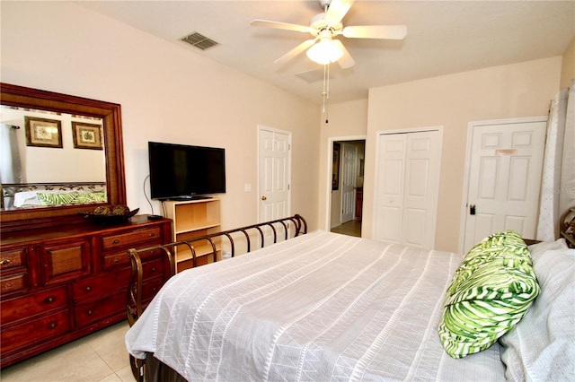 tiled bedroom with ceiling fan