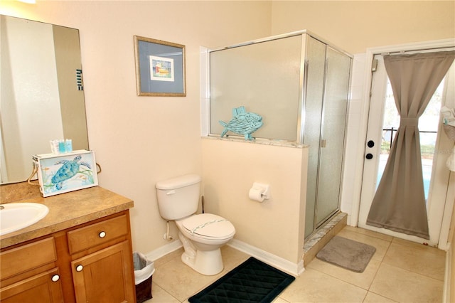 bathroom featuring walk in shower, tile patterned flooring, vanity, and toilet