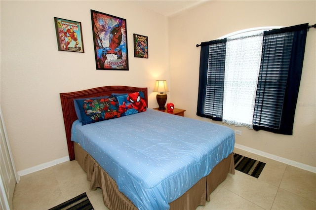 bedroom featuring light tile patterned floors