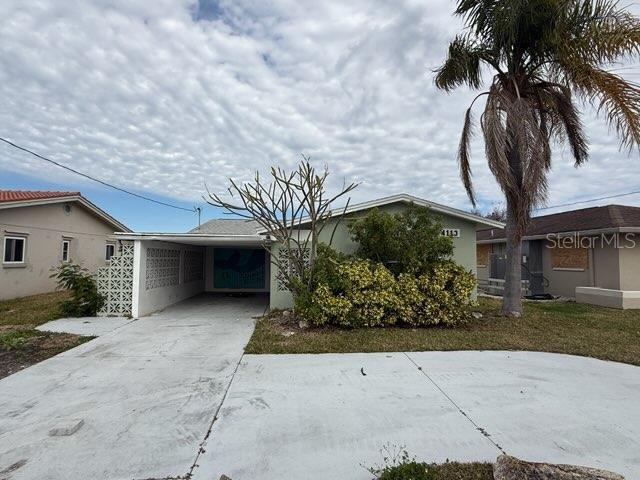 single story home with a carport