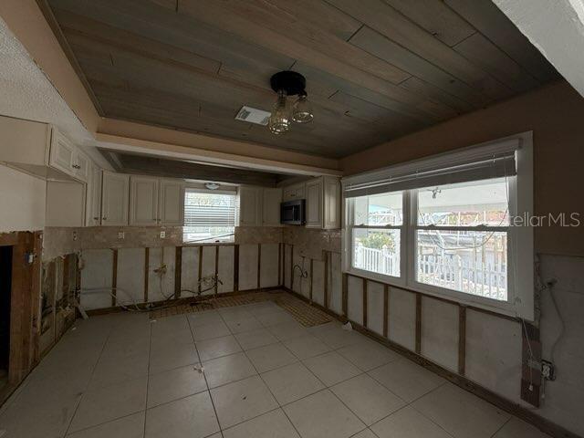 unfurnished room featuring wood ceiling