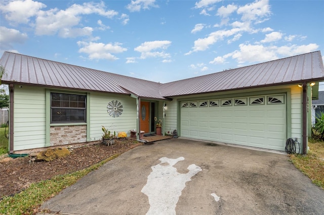 ranch-style home featuring a garage