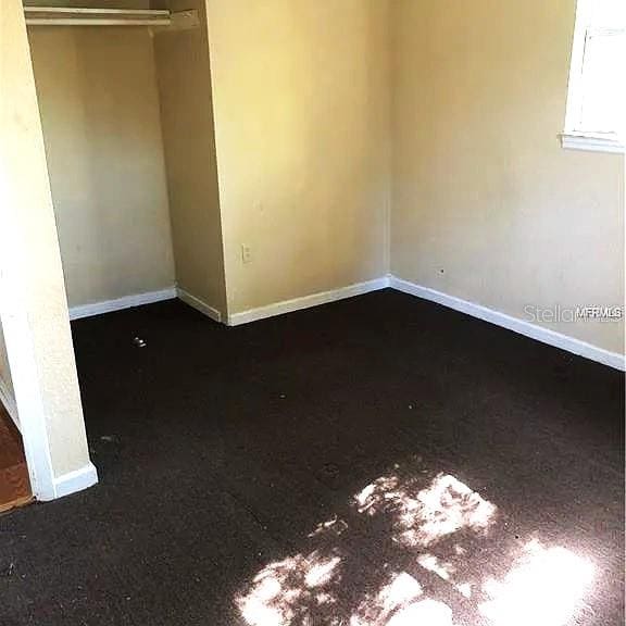 unfurnished bedroom with a closet