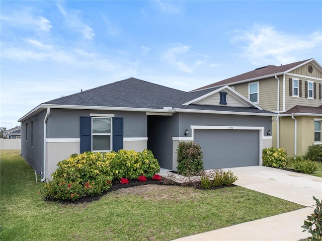 view of front facade featuring a garage and a front yard