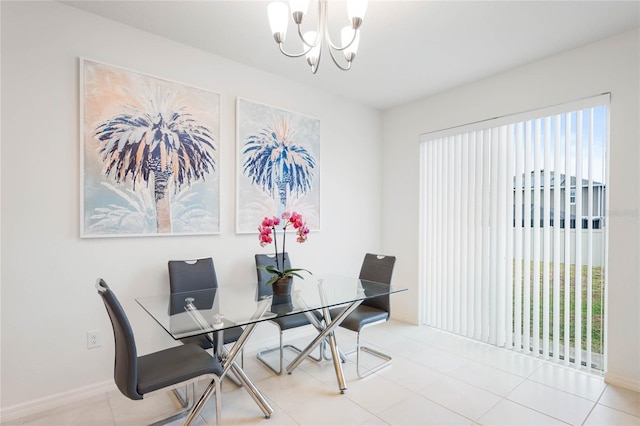 tiled dining area featuring a chandelier