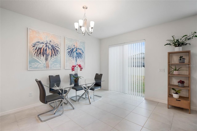 tiled dining area featuring an inviting chandelier