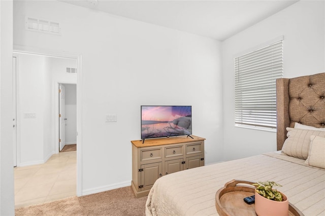 bedroom with light carpet