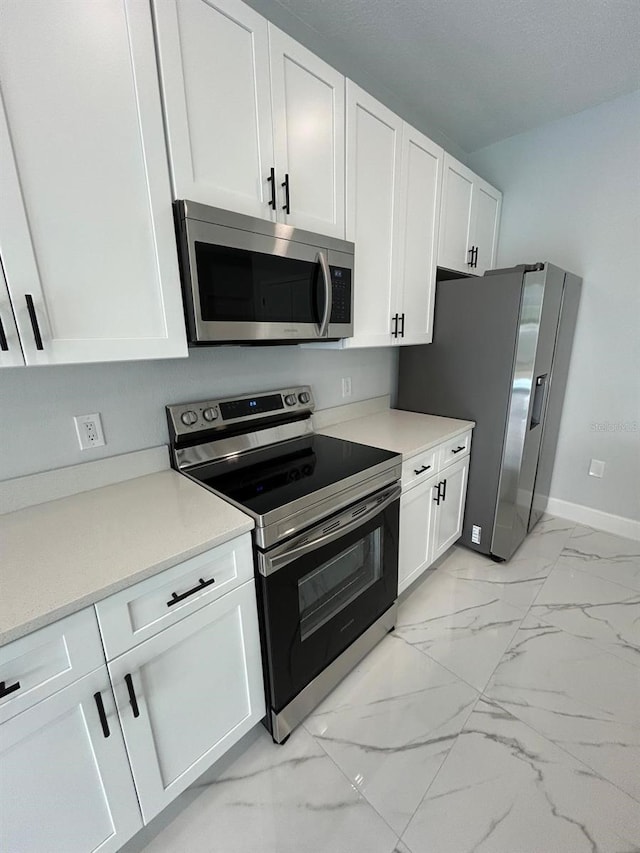 kitchen with white cabinets and stainless steel appliances