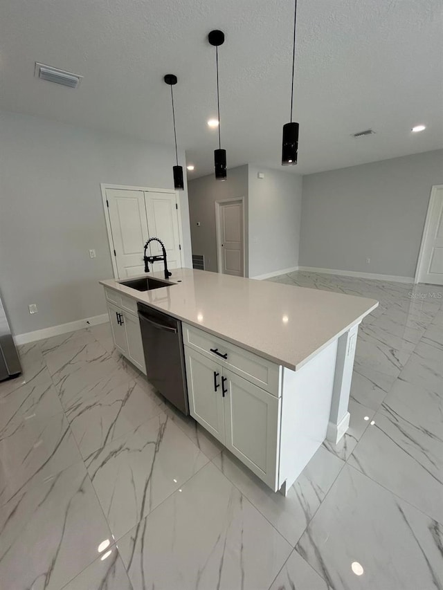 kitchen featuring white cabinets, black dishwasher, sink, and a kitchen island with sink