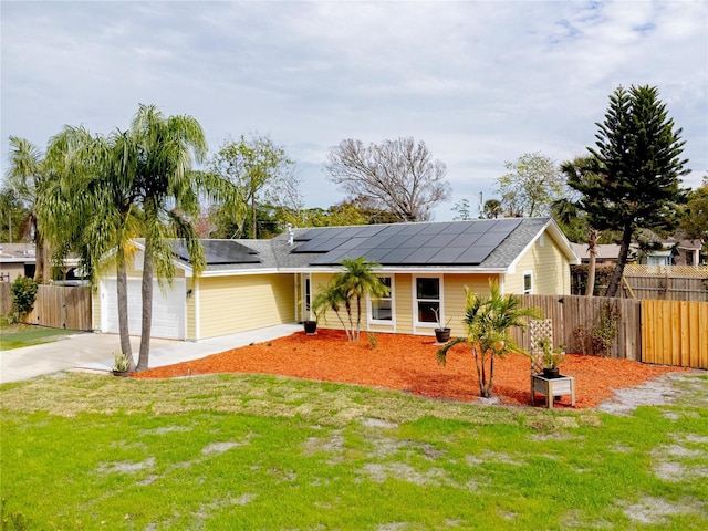 single story home featuring solar panels, a front lawn, and a garage