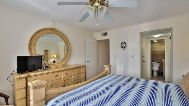 bedroom featuring ceiling fan and ensuite bathroom