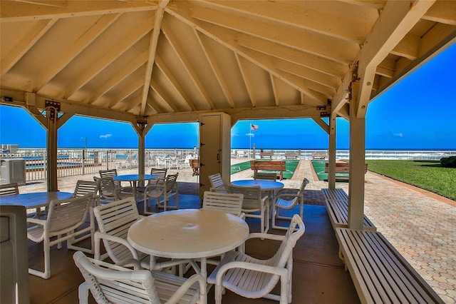 view of patio / terrace featuring a gazebo and a water view