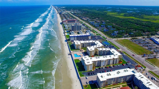 birds eye view of property featuring a view of the beach and a water view