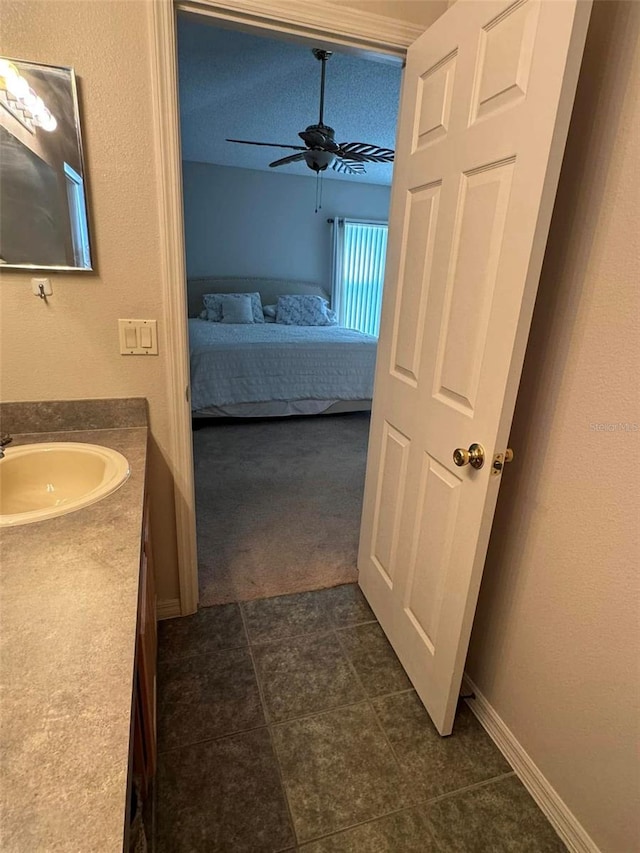 bathroom featuring vanity and ceiling fan