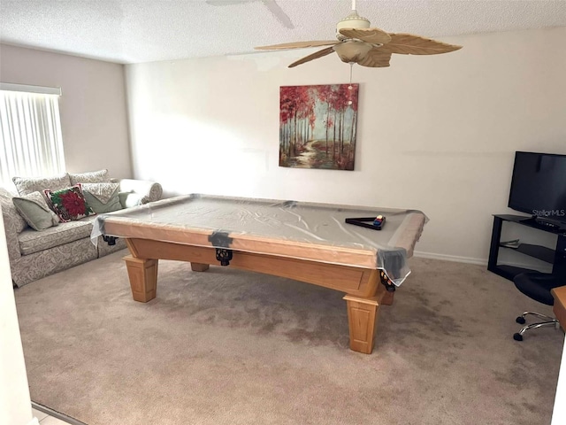 rec room with a textured ceiling, carpet floors, ceiling fan, and billiards