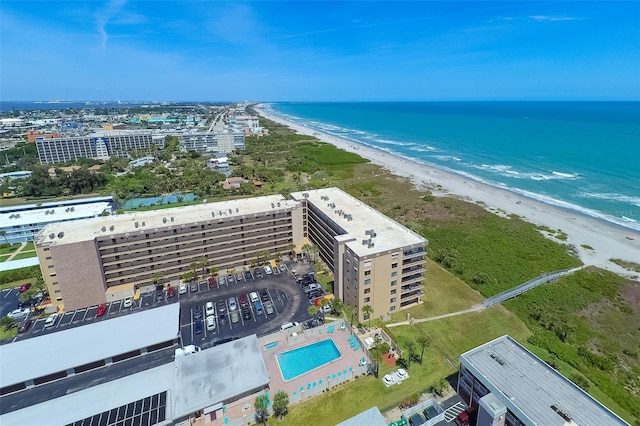 aerial view featuring a view of the beach and a water view