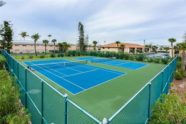 view of tennis court with basketball court