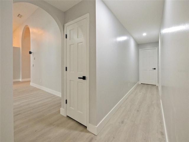 hallway with light wood-type flooring