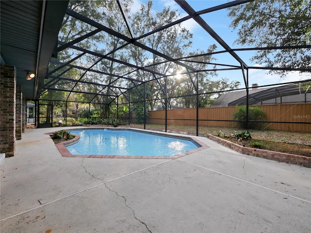 view of pool with a lanai and a patio area