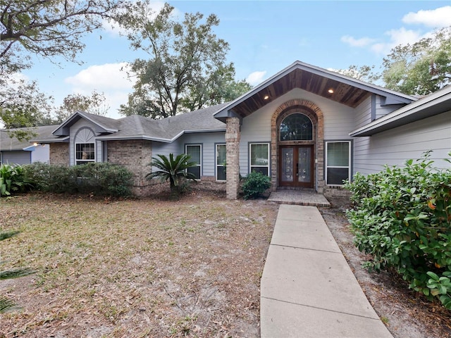 ranch-style house with french doors