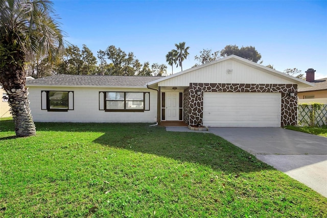 ranch-style home featuring a front yard and a garage