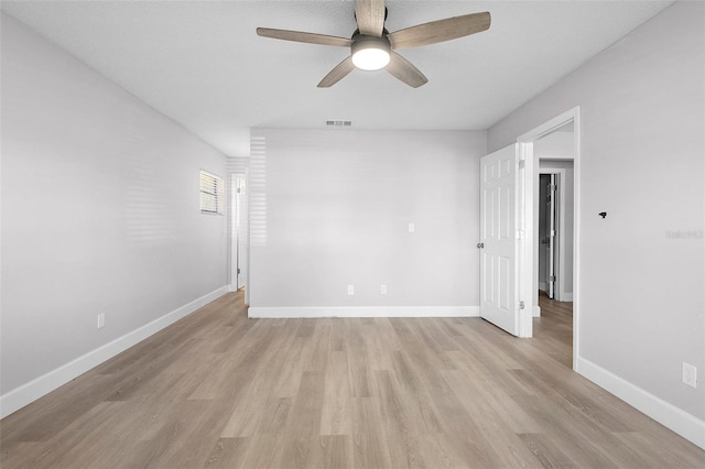 unfurnished room featuring ceiling fan and light wood-type flooring