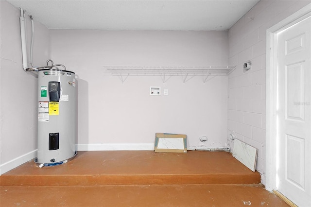 laundry room with electric water heater and washer hookup