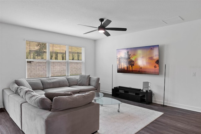 living room with dark hardwood / wood-style floors and ceiling fan