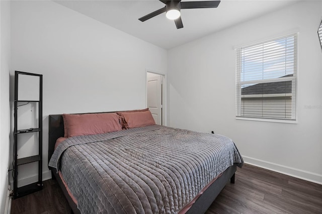 bedroom featuring ceiling fan and dark hardwood / wood-style floors