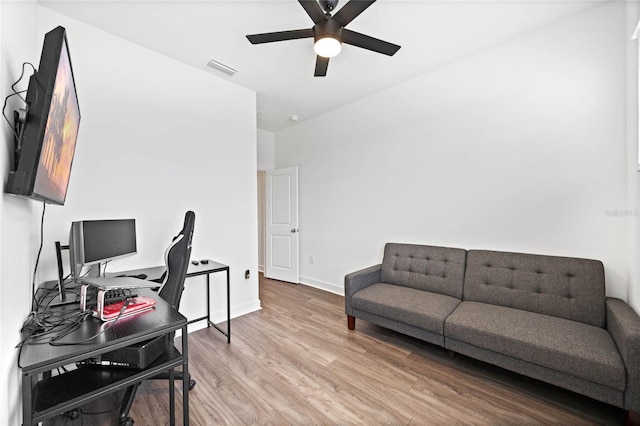 office area featuring light hardwood / wood-style flooring and ceiling fan