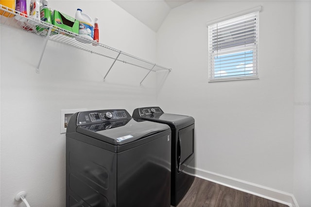 laundry area featuring dark hardwood / wood-style flooring and washer and clothes dryer