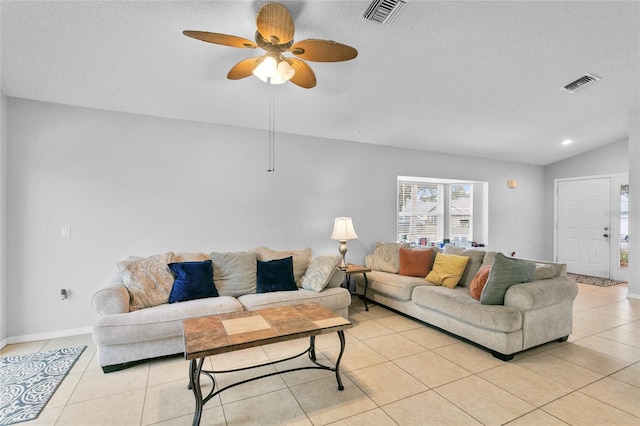 living room with light tile patterned floors, visible vents, ceiling fan, and lofted ceiling