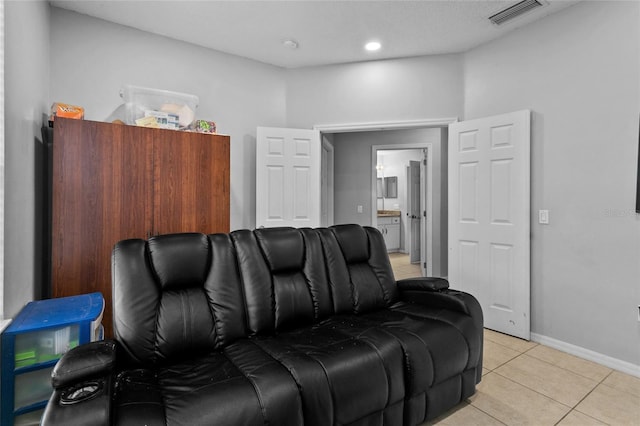 cinema room with recessed lighting, light tile patterned floors, baseboards, and visible vents