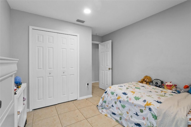 1685 Waterview Loop, Haines City, FL 33844 - bedroom with light tile patterned floors, visible vents, baseboards, and a closet