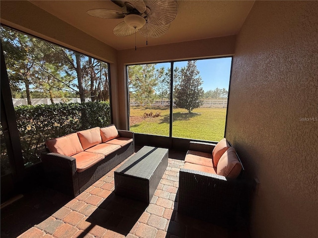 sunroom / solarium with ceiling fan