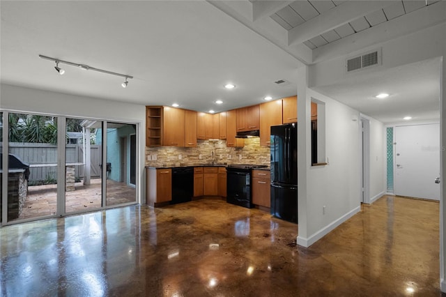 kitchen featuring tasteful backsplash, concrete floors, and black appliances