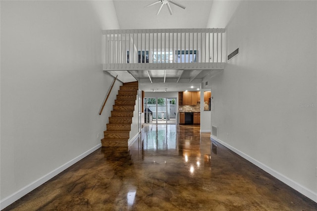 unfurnished living room featuring ceiling fan