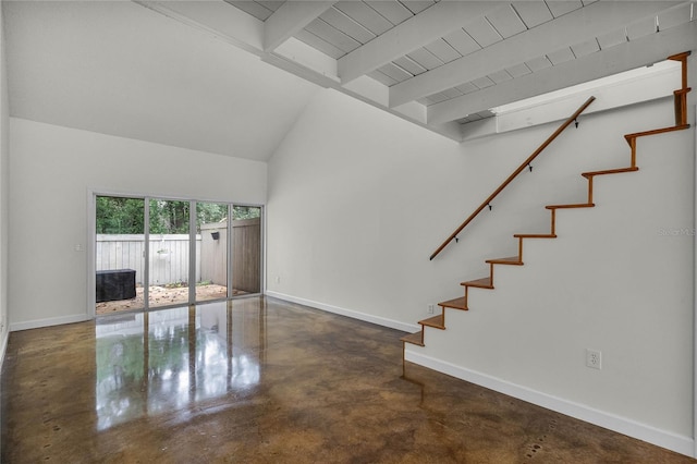 interior space featuring lofted ceiling with beams and wooden ceiling