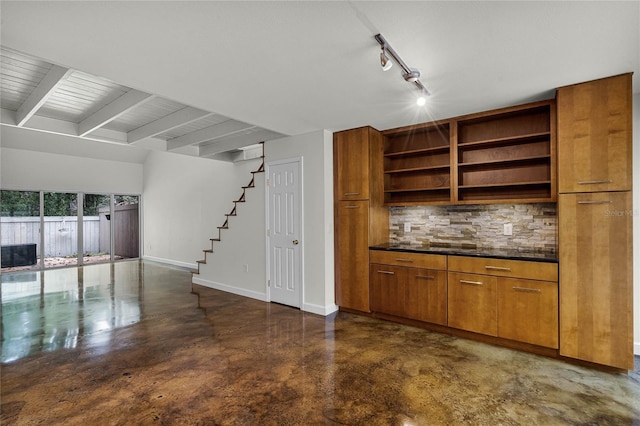 unfurnished living room featuring beamed ceiling