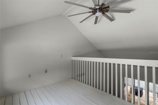 interior space with ceiling fan