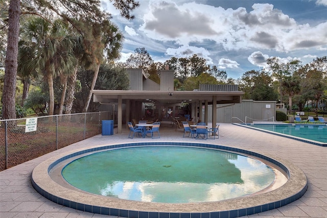 view of pool featuring a patio