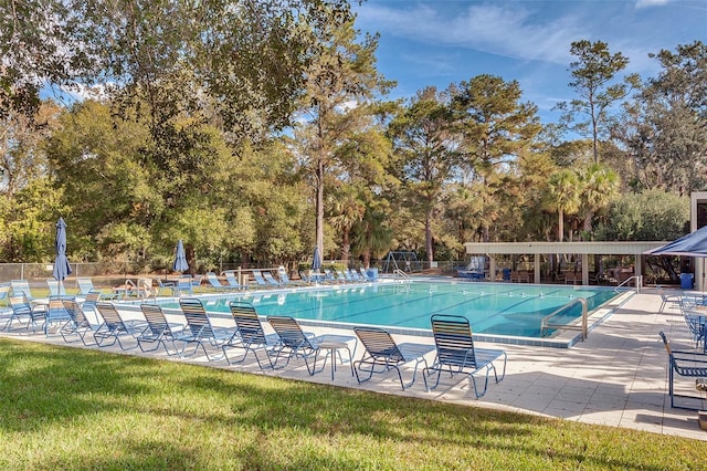 view of swimming pool with a patio