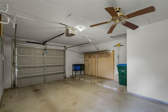 garage featuring ceiling fan and a garage door opener