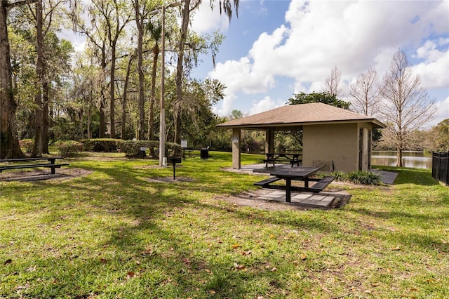 view of yard with a gazebo and a water view